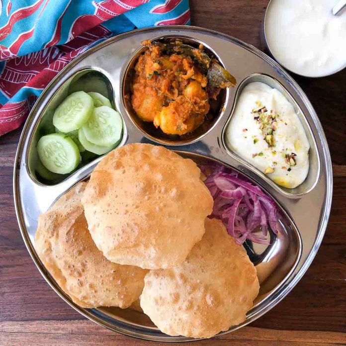 Meal_Plate_Dum_Aloo_Shrikhand_Puri_Pickled_onions-kidhours